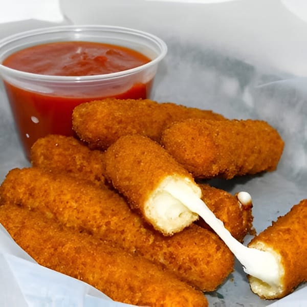 Golden-brown mozzarella sticks with a side of red dipping sauce, one stick stretching with melted cheese.
